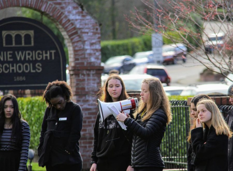 Julia Henning shares an original poem with participants in the Annie Wright walkout on Wednesday.