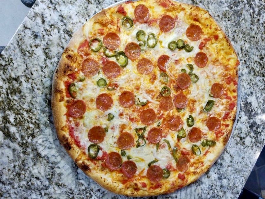 This pizza, called the Spanish Harlem, has jalapeños, pepperoni, and onions. 
