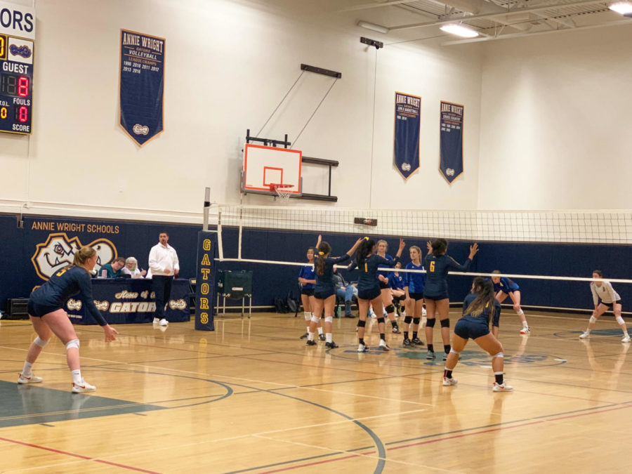 The varsity volleyball team, comprising mostly freshman, advances in districts.