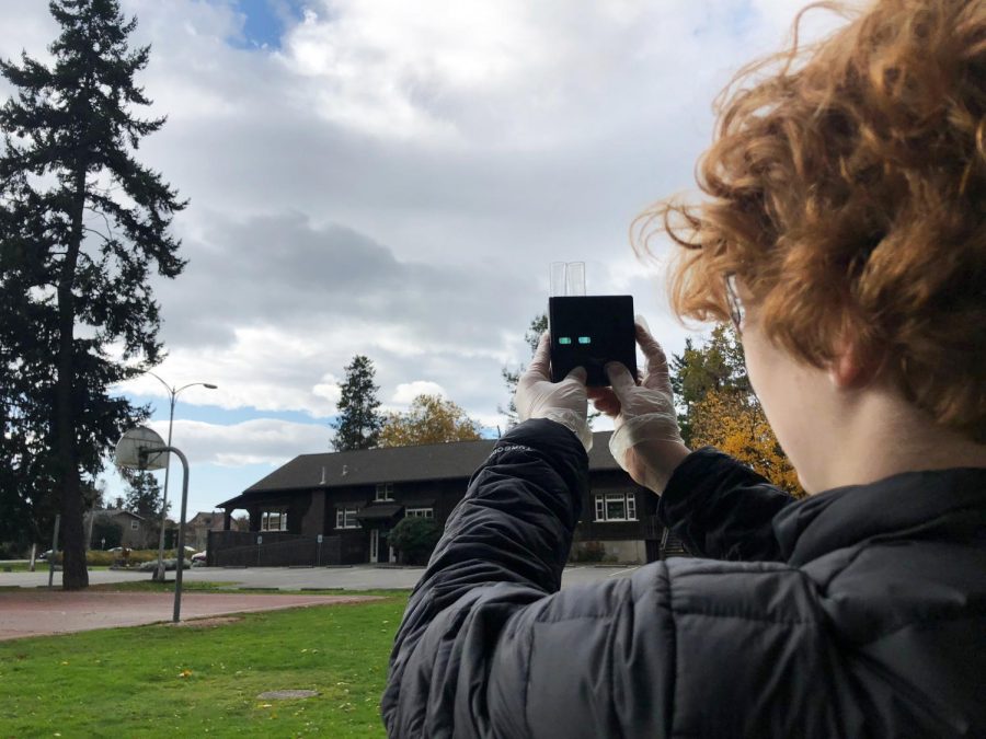 Junior Emily Muehlenkamp tests water at Crystal Springs State Park during a field trip for her IB Environmental Systems and Societies course.